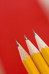 Image showing pencils on red background