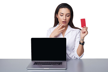 Image showing Business woman with laptop showing credit card