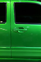 Image showing Door of green pickup truck