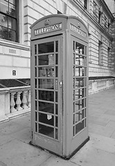 Image showing Black and white Red phone box in London