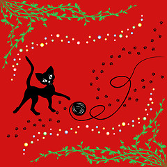 Image showing Black cat playing with ball of yarn