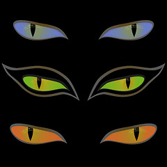 Image showing Three pairs of cat eyes over black