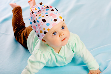 Image showing baby girl in a hat. Studio