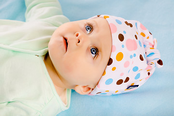 Image showing baby girl in a hat. Studio