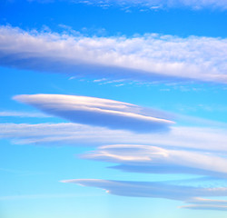 Image showing in the blue sky white soft clouds and abstract background