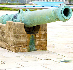 Image showing bronze cannon in africa morocco  green  and the old pavement