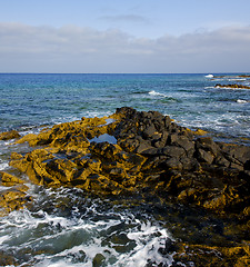 Image showing water  in lanzarote  isle foam rock   stone sky cloud beach  