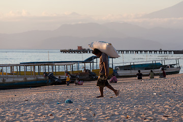 Image showing Men transports cargo from ship