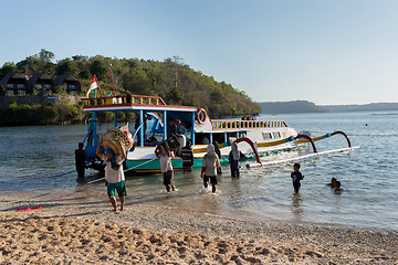 Image showing Men transports cargo from ship