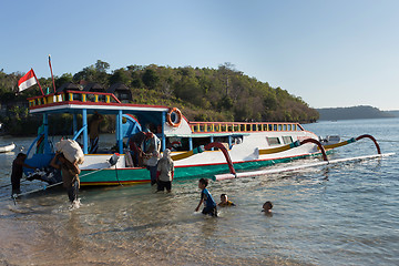 Image showing Men transports cargo from ship