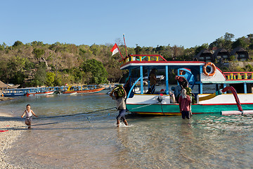 Image showing Men transports cargo from ship