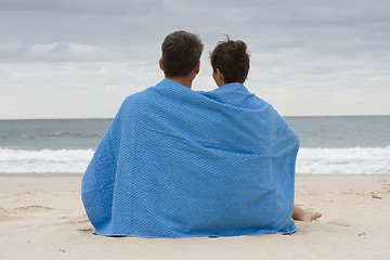 Image showing Couple sitting on the beach