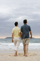 Image showing Couple walking on the beach