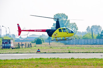 Image showing Pilot of Robinson R44 Raven on airshow