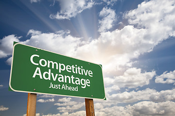 Image showing Competitive Advantage Green Road Sign Over Clouds