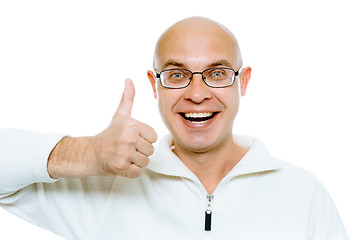 Image showing Bald man smiling with thumb up. Isolated on white. Studio