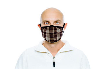 Image showing Bald, man in a white jacket and mask. Studio. isolated