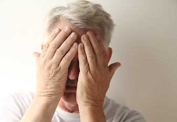 Image showing Man covers his face. 