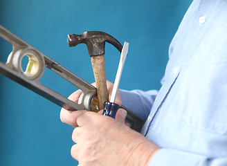 Image showing tools in a man's hand