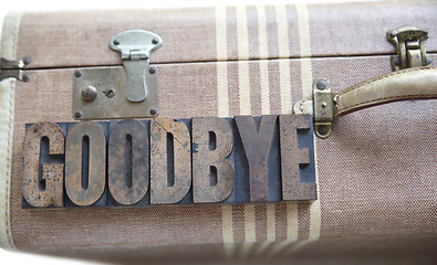 Image showing goodbye word on vintage suitcase