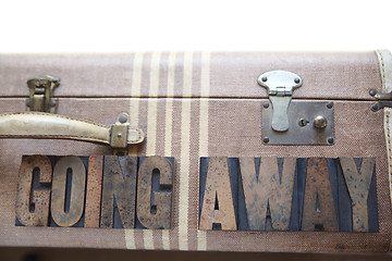 Image showing vintage luggage with words going away
