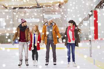 Image showing happy friends on skating rink