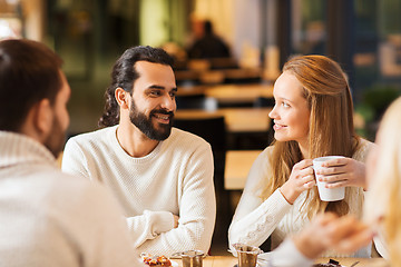 Image showing happy couple meeting and drinking tea or coffee