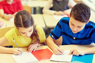 Image showing group of school kids writing test in classroom