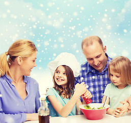 Image showing happy family with two kids making salad at home