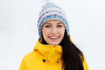 Image showing happy young woman in winter clothes outdoors