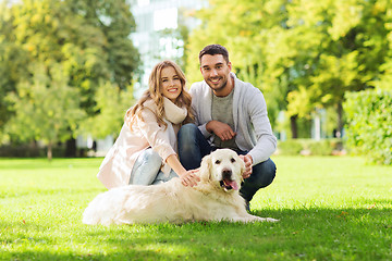 Image showing happy couple with labrador dog walking in city