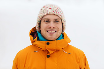 Image showing happy young man in winter clothes outdoors