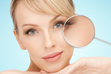 Image showing beautiful young woman face over blue background