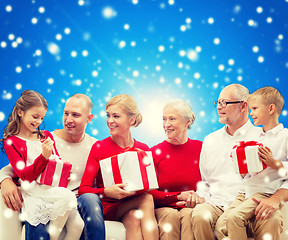 Image showing smiling family with gifts