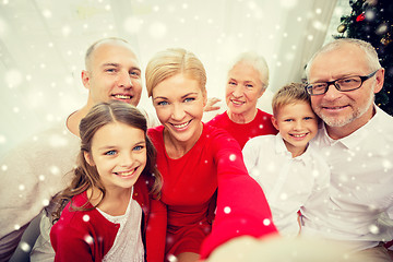 Image showing smiling family making selfie at home