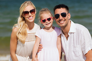 Image showing happy family in sunglasses on summer beach