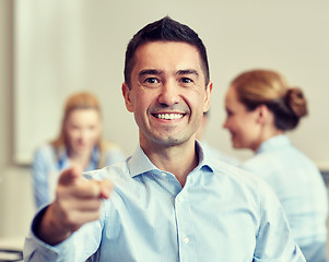 Image showing group of smiling businesspeople meeting in office