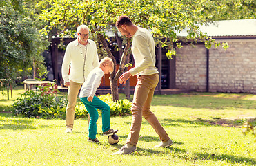 Image showing happy family playing football outdoors