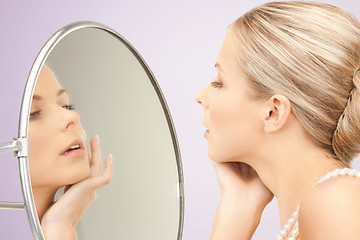 Image showing beautiful woman with pearl necklace and mirror