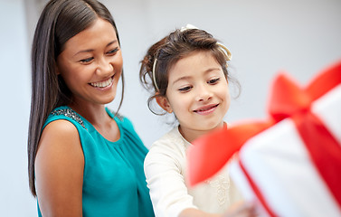 Image showing happy mother and child with gift box