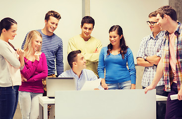 Image showing group of students and teacher with laptop