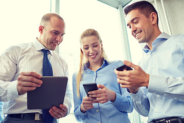 Image showing business people with tablet pc and smartphones