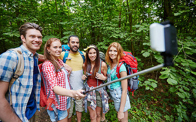 Image showing friends with backpack taking selfie by smartphone