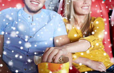 Image showing happy couple with popcorn in movie theater