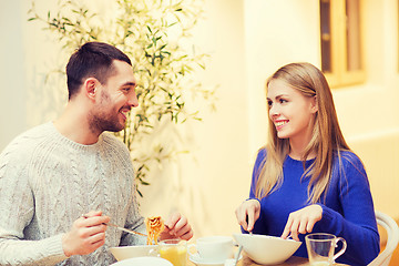 Image showing happy couple meeting and having dinner at cafe