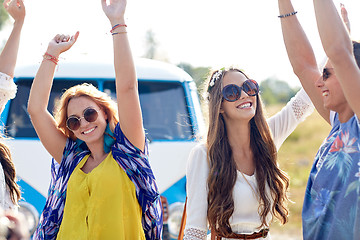 Image showing happy young hippie friends dancing outdoors