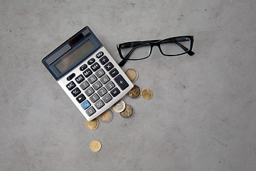 Image showing calculator, eyeglasses and euro coins on table