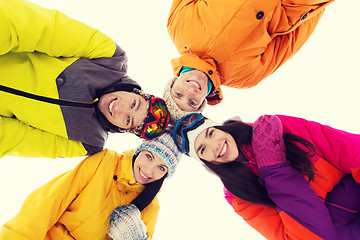 Image showing happy friends in ski goggles outdoors