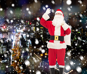 Image showing man in costume of santa claus with bag