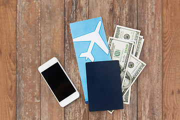 Image showing air ticket, money, smartphone and passport